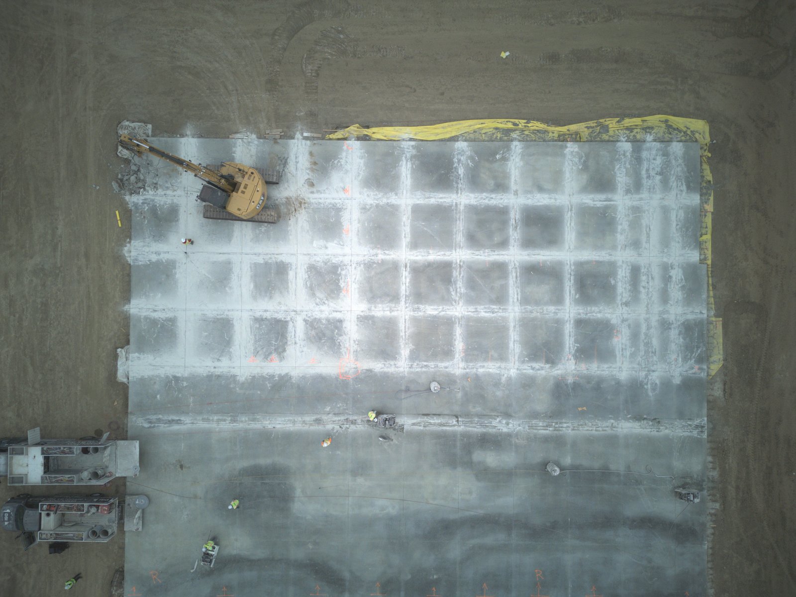 Top-down aerial of concrete slab demolition grid pattern